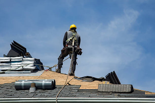 Professional Roof Replacement technician working in Dedham, MA
